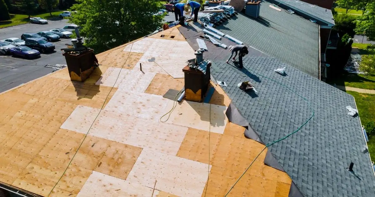 Roof replacement in progress on residential building