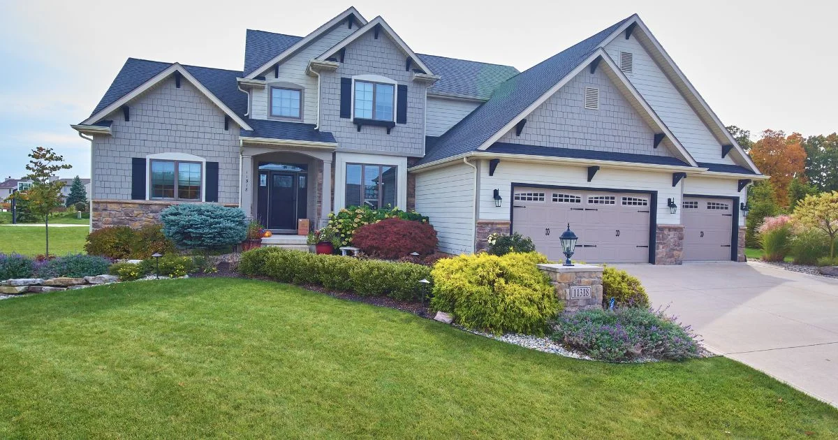 Modern house with siding, brick and double garage