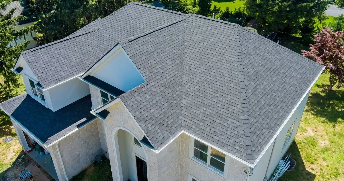 Aerial view of residential roof with grey asphalt shingles